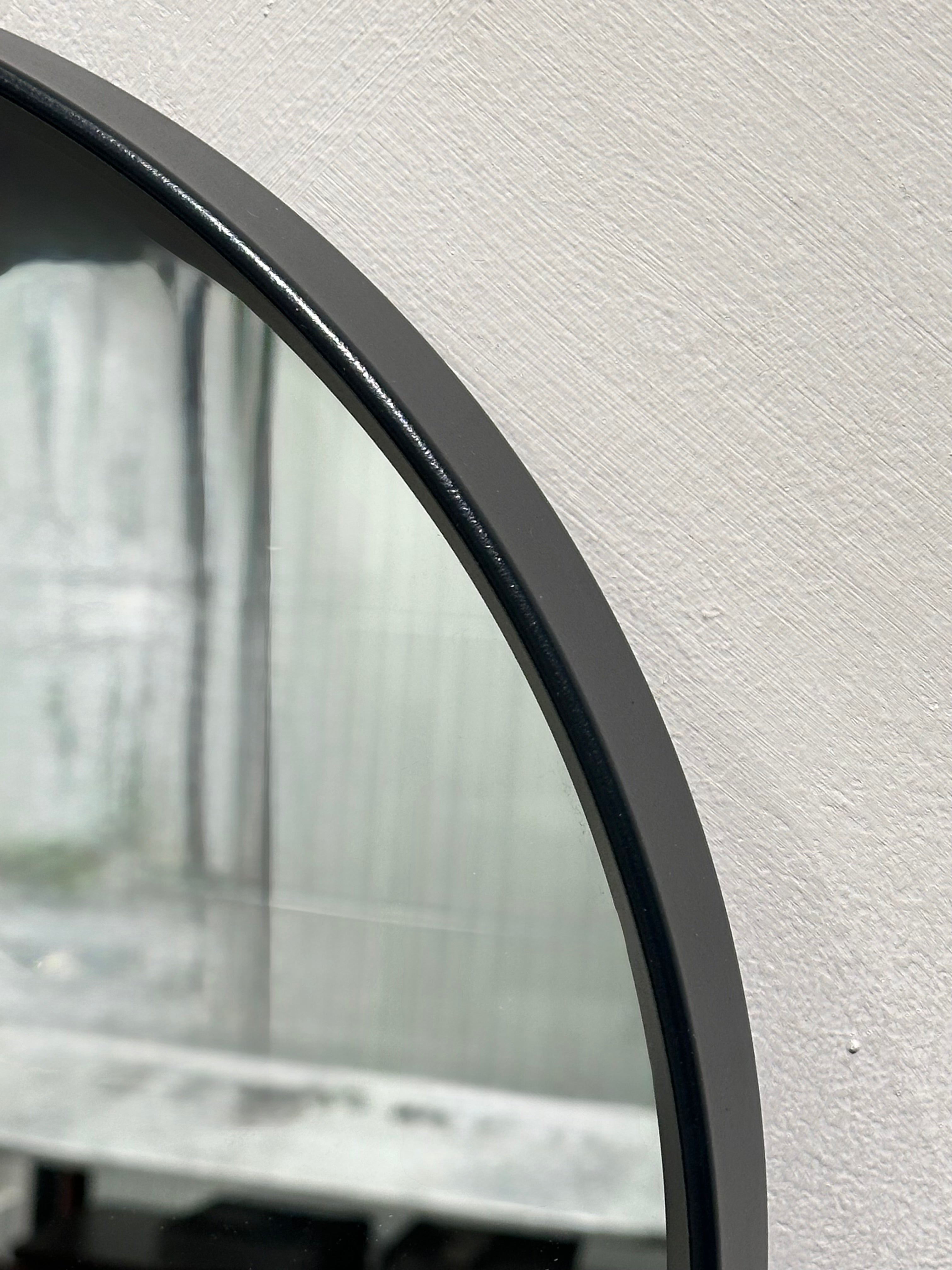 Miroir noir ovale